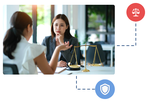 Two women sitting at a table having a meeting, symbolizing the collaboration and legal compliance of a Global Employer of Record service